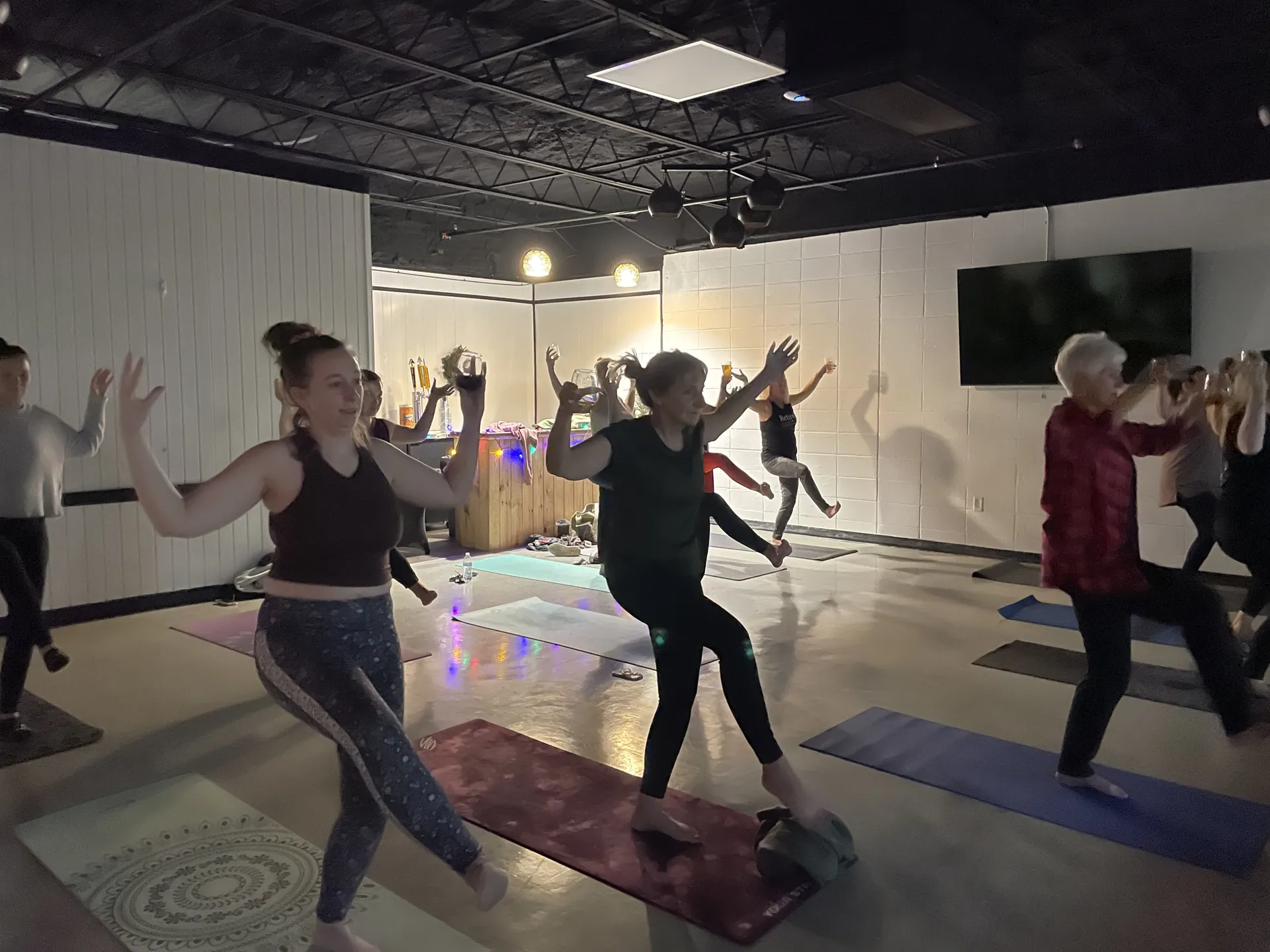 Students moving through a playful flow at a community event.
