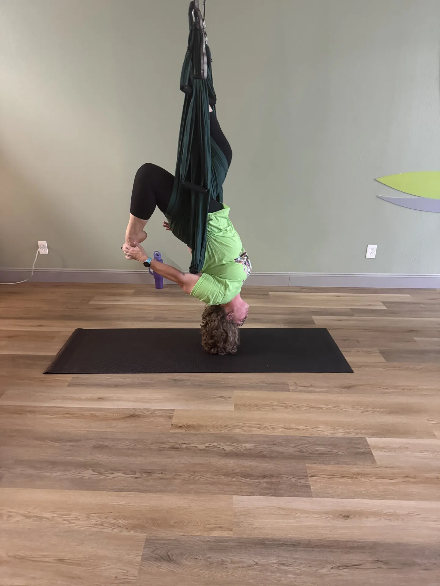 An inversion in the yoga trapeze.