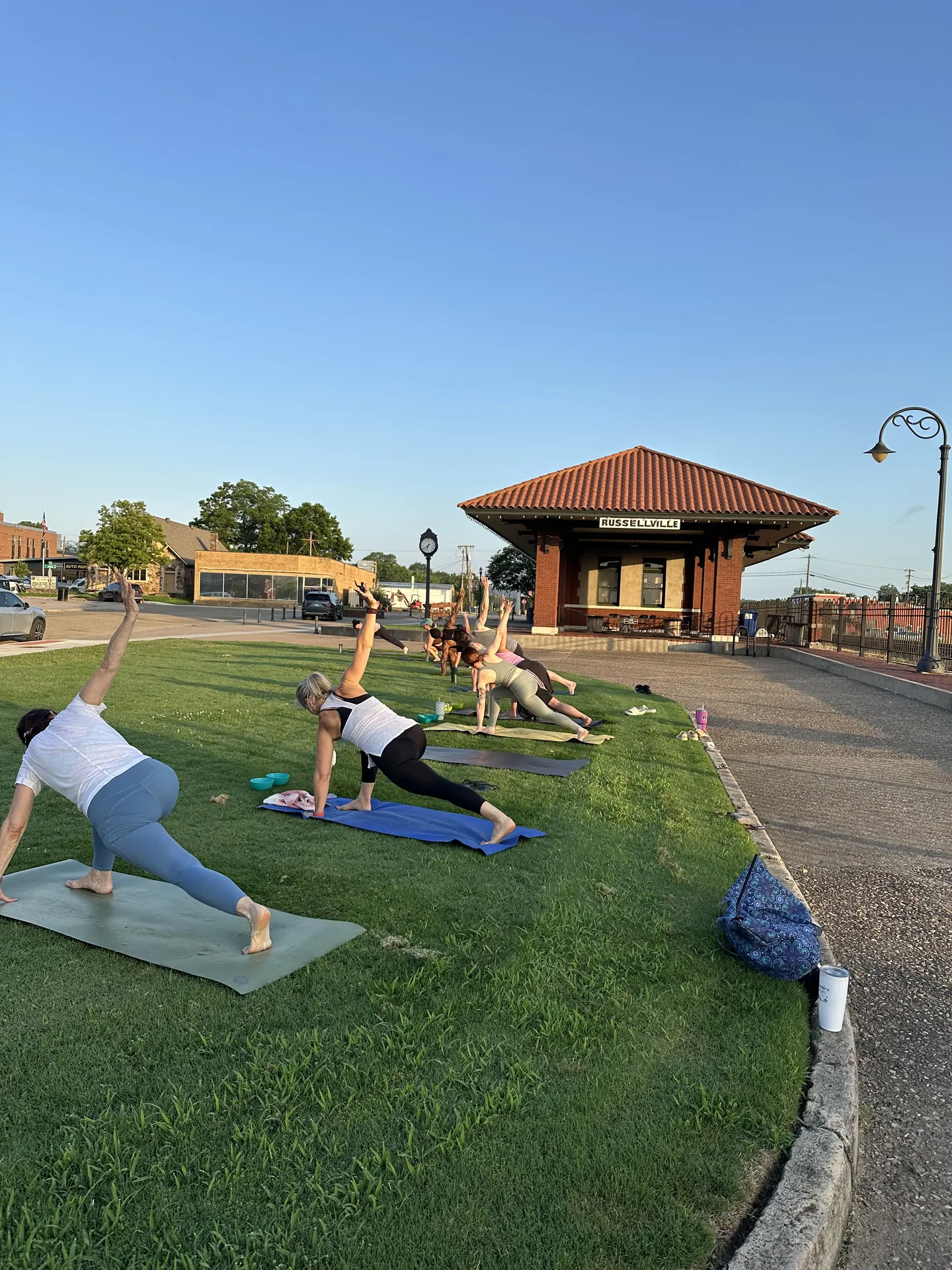 Side plank on the lawn by the Depot at the Farmers Market kickoff practice.