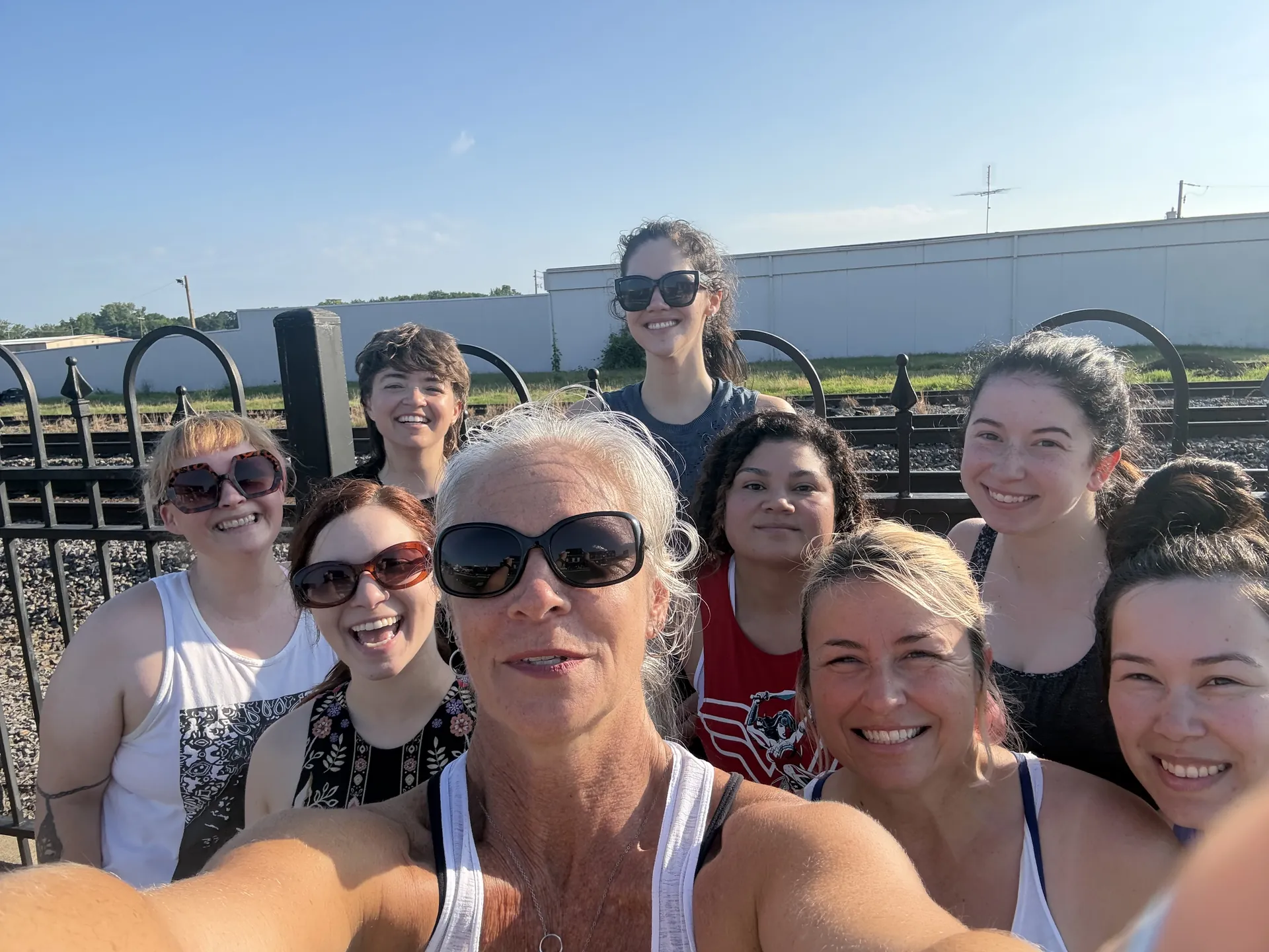 A sunny group selfie after an outdoor practice.