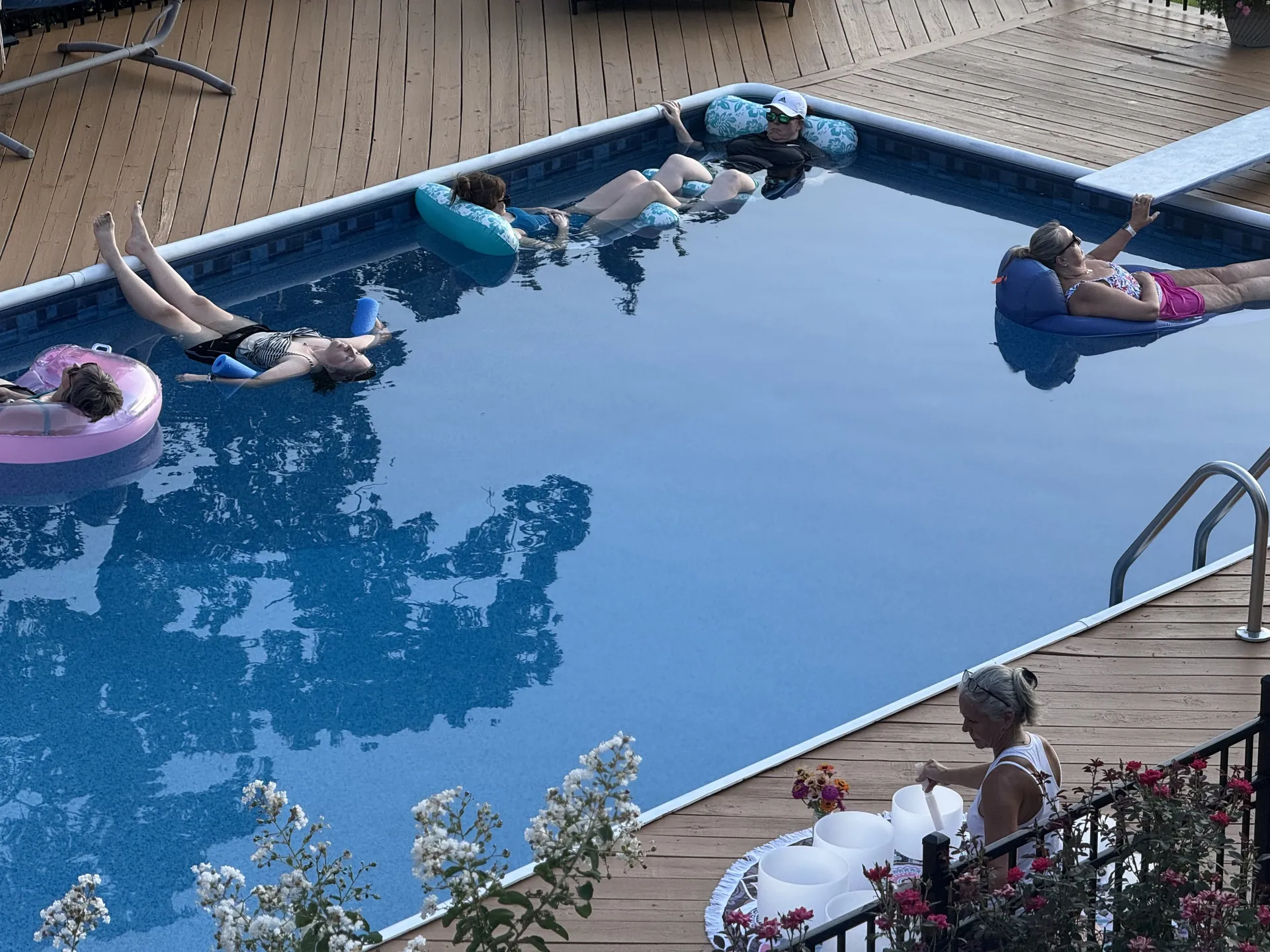 Floating in the pool during a water sound bath.