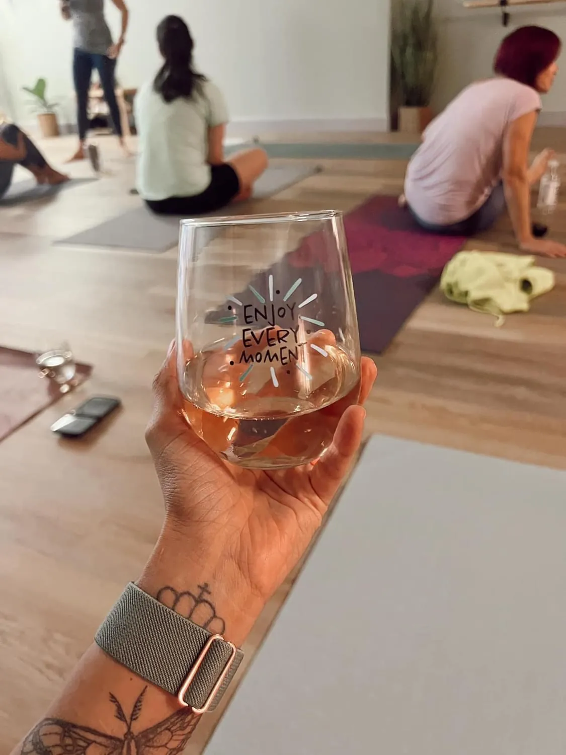 Sip + Stretch: a glass raised after practice.