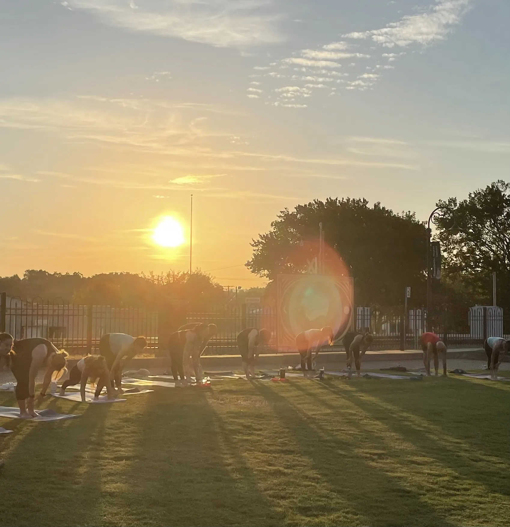 Sunrise breaking over an early-morning outdoor practice.